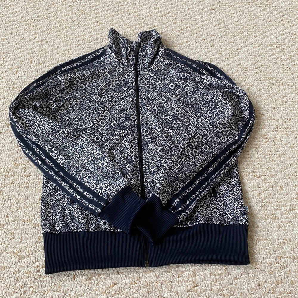 black and white adidas full zip jacket with stripes on the arms
